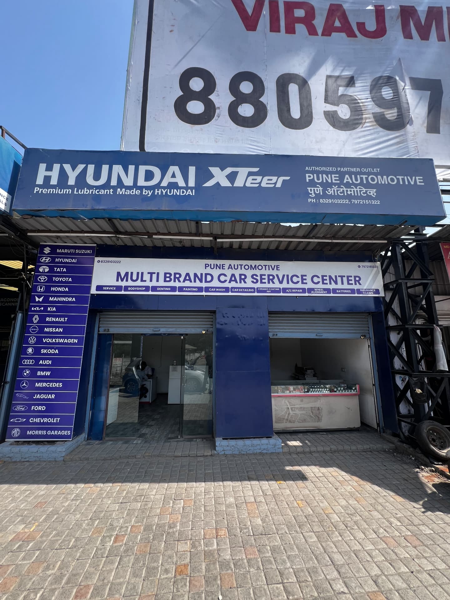 Hyundai XTeer authorised partner outlet signage above the Pune Automotive service centre